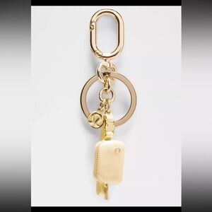 Lululemon Athletica Gold and Cream Key Holder